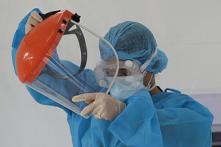 The Latest: Egypt churches reopen as new infections wane