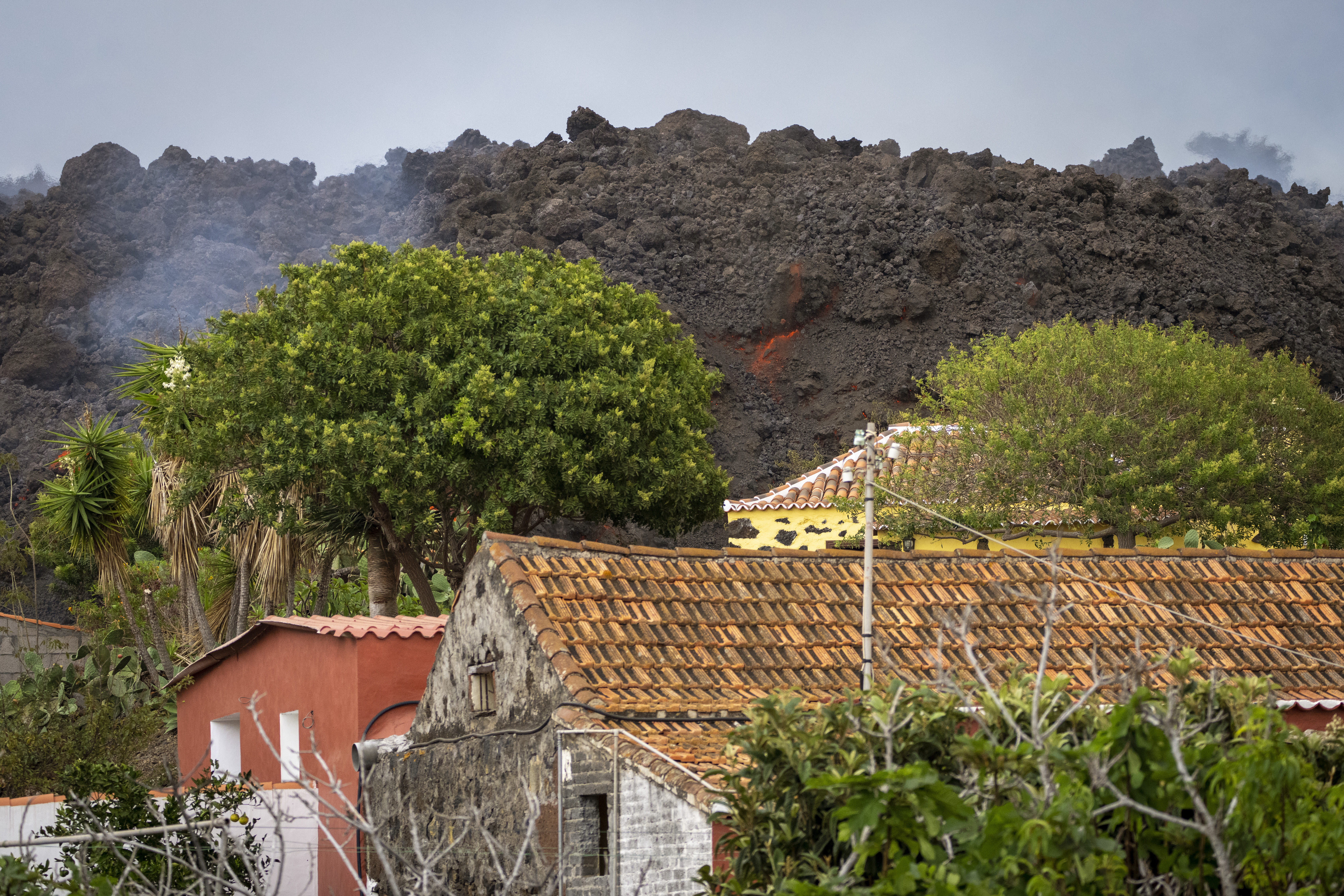 ‘My whole life in a van’: Islanders flee Spanish volcano