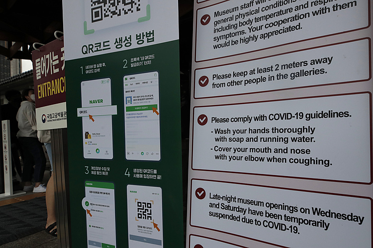 The Latest: S Korea baseball, soccer fans to return to games