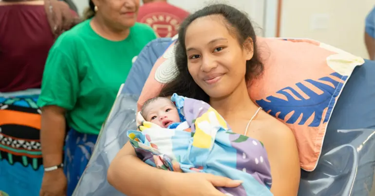 Christmas baby says hello