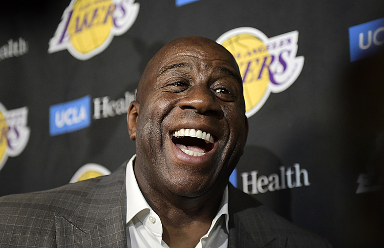 Without basketball, Magic Johnson shifts focus to community