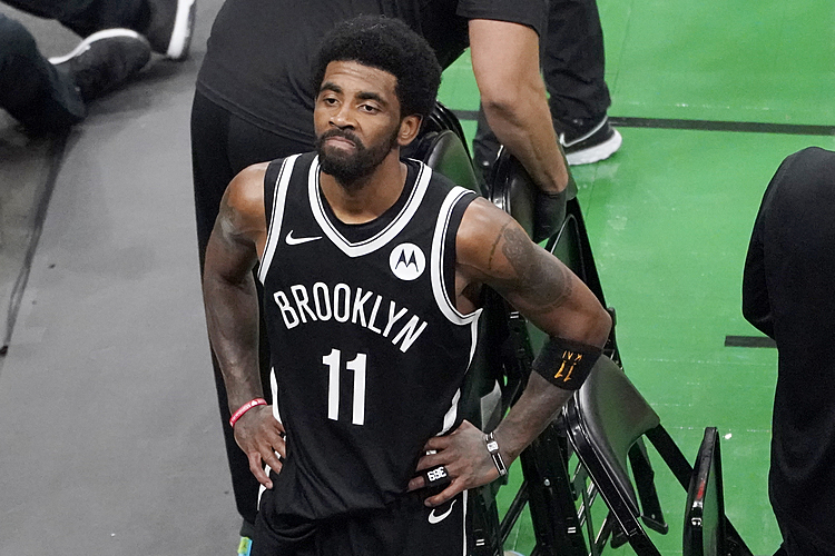 Kyrie Irving skips the jab and benches himself -- for now