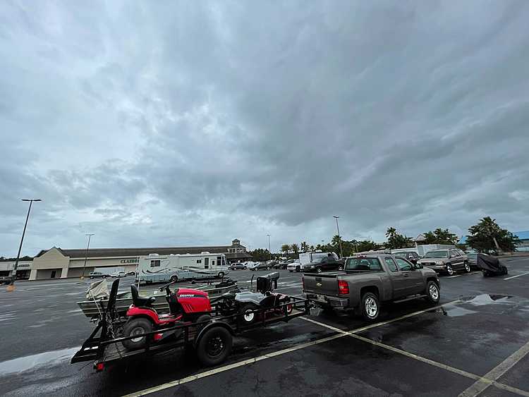 Tropical weather lashes Gulf Coast with brisk winds, rain