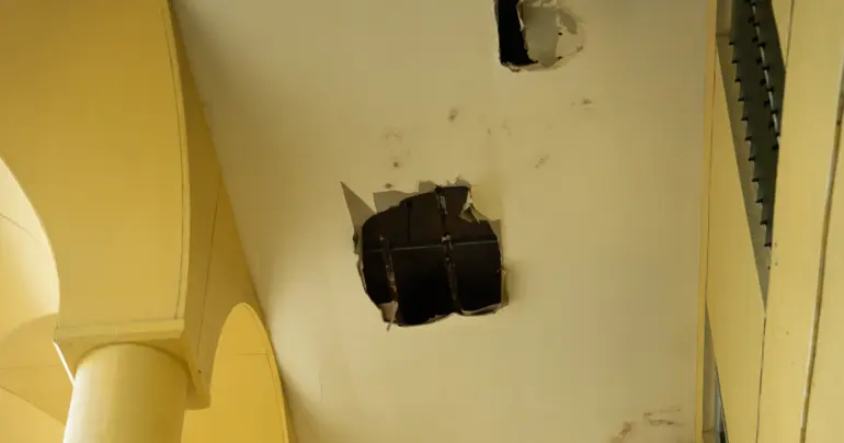 Woman dodges falling courthouse ceiling